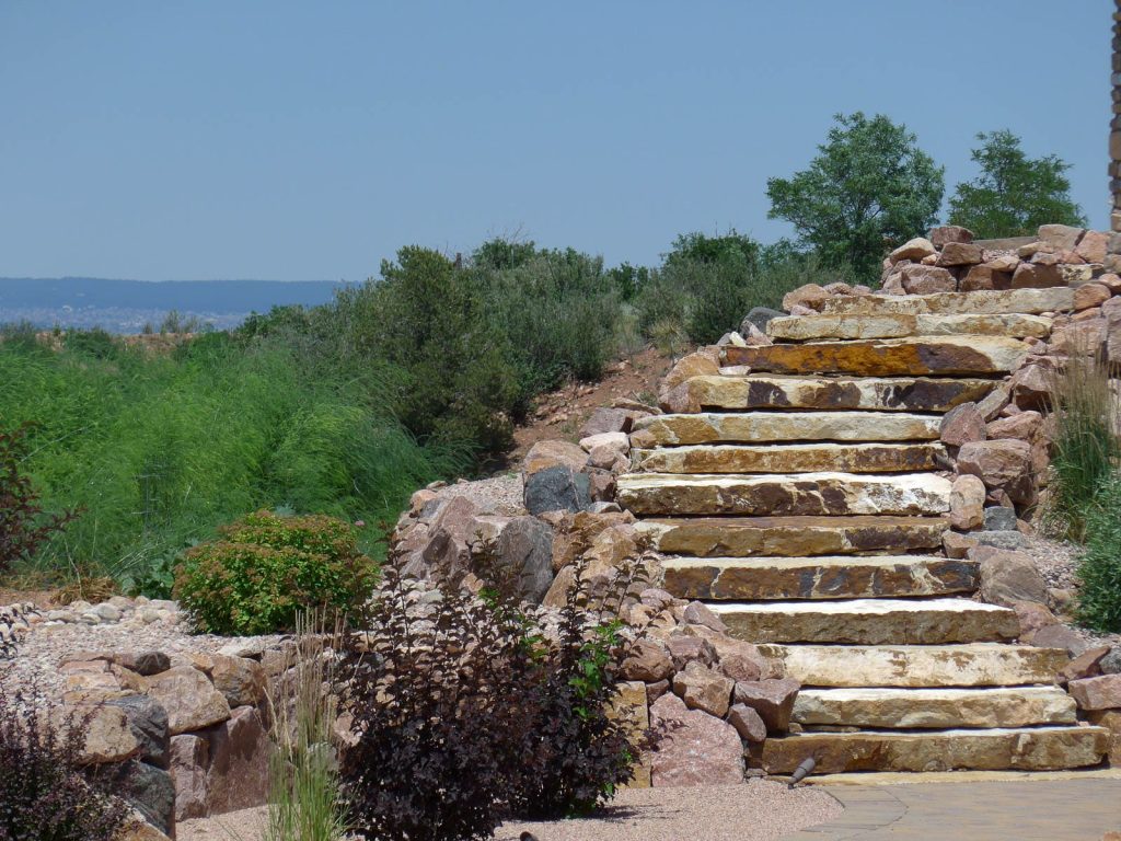 Image of a backyard transformation with custom hardscaping and landscape design in Colorado Springs