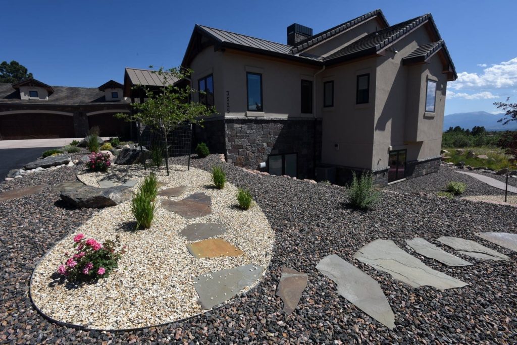Image of a xeriscaping contractor project featuring natural stone surfaces in Colorado Springs