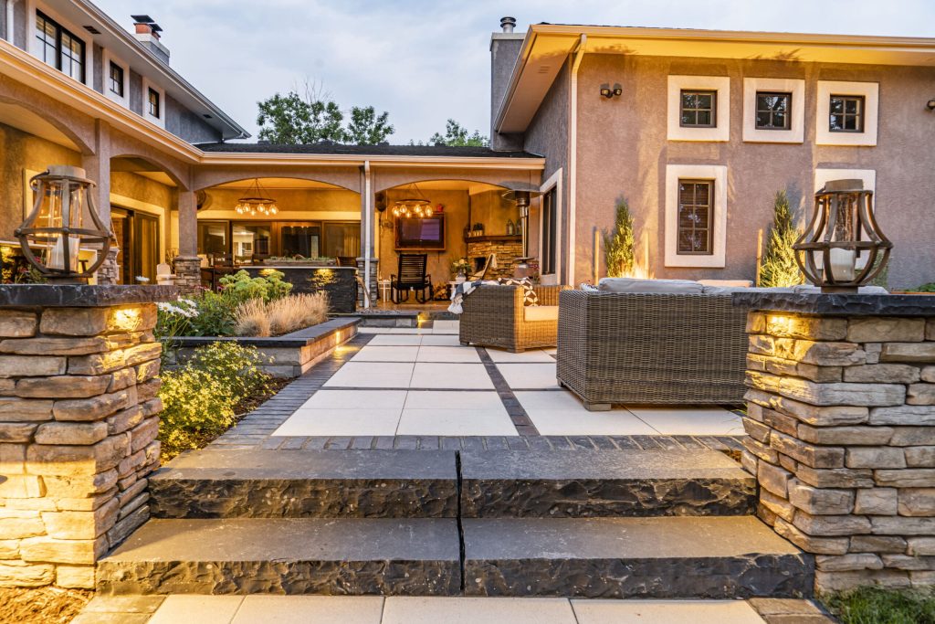 Image of a luxury backyard patio with landscape design and outdoor seating in Colorado Springs