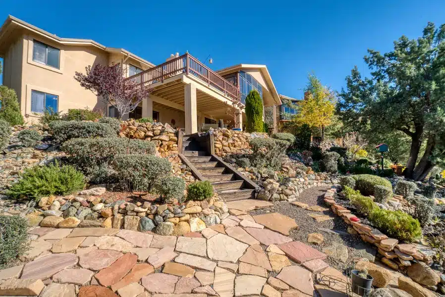 Image of flagstone patio on a sloped lot.